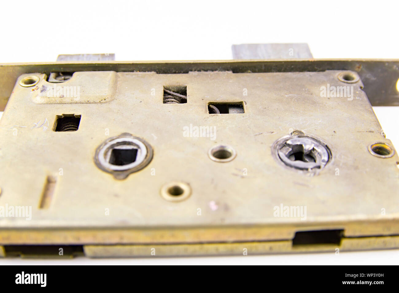Disassembled door lock isolated against white background. Place for ...