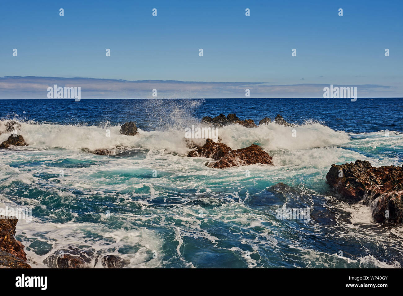 Atlantic Ocean and waves breaking along a rugged coastline. Madeira Stock Photo