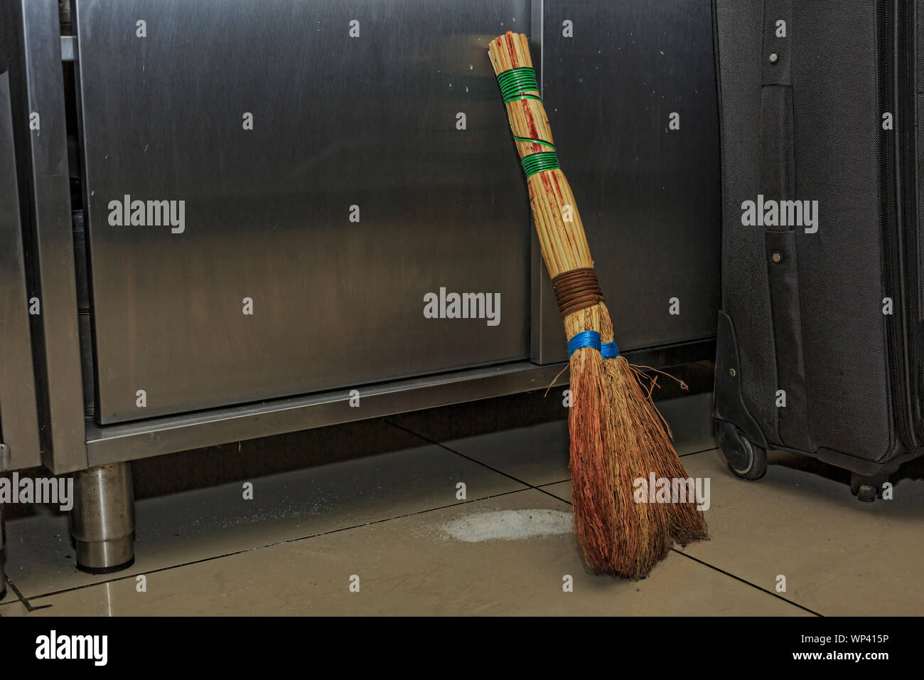 Man sweeping floor dustpan broom hires stock photography and images