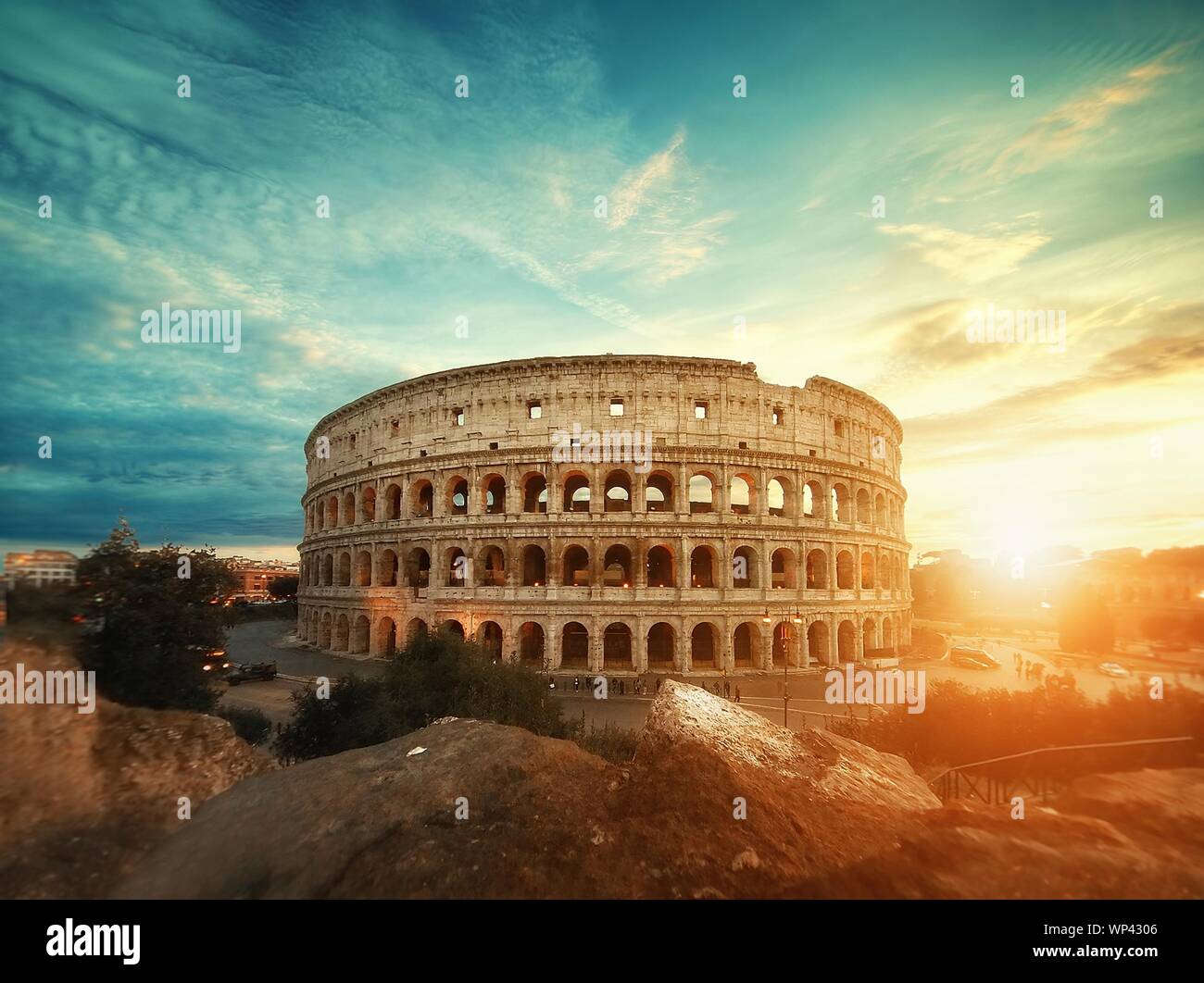 Beautiful shot of the famous Roman Colosseum amphitheater under the  breathtaking sky at sunrise Stock Photo - Alamy