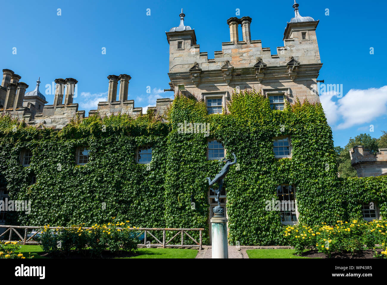 Ivy covered courtyard with Statue of Hermes at Floors Castle near Kelso, Scottish Borders, Scotland, UK Stock Photo