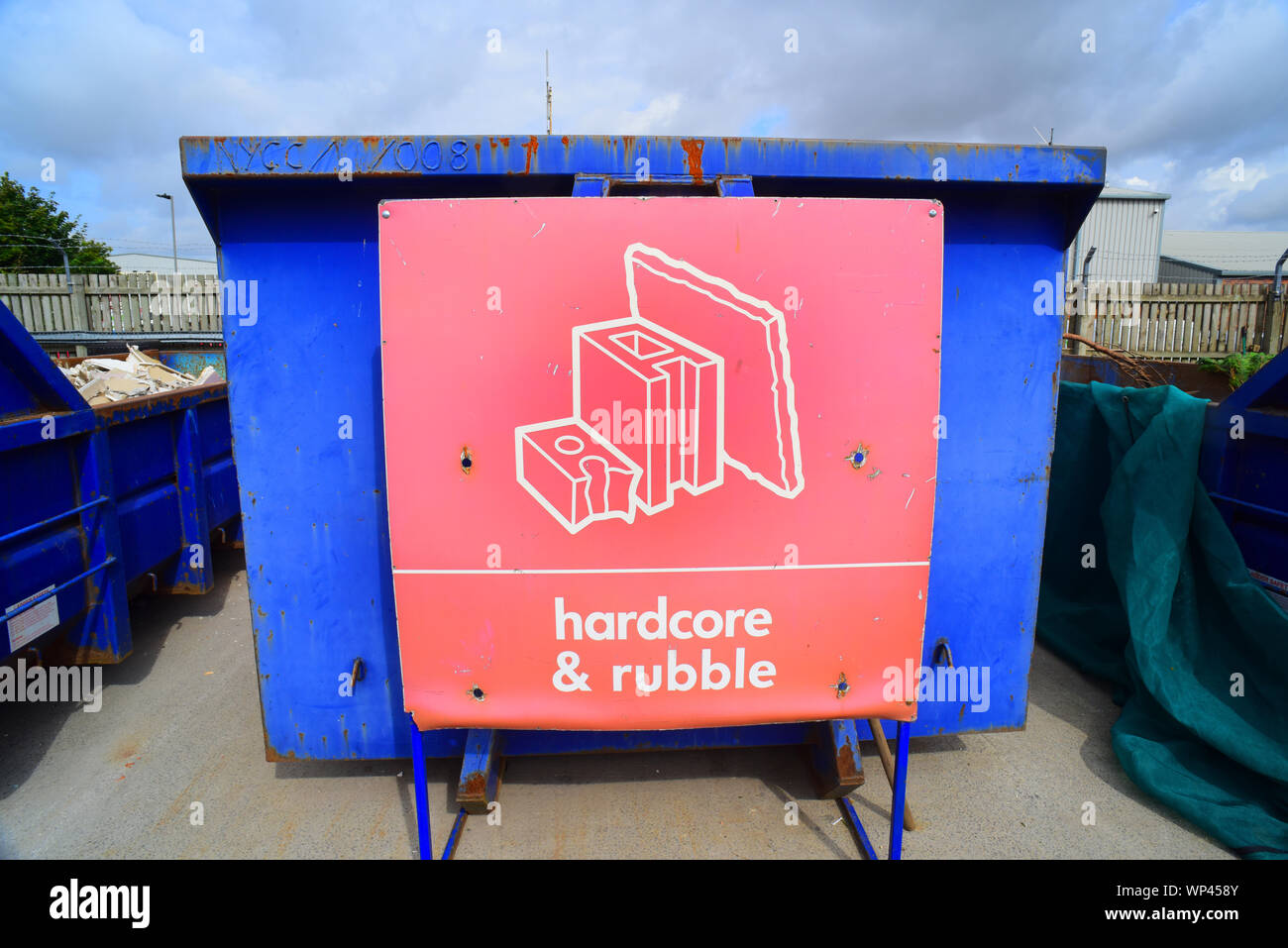 skip full of hardcore and rubble at concil houshold recycling centre