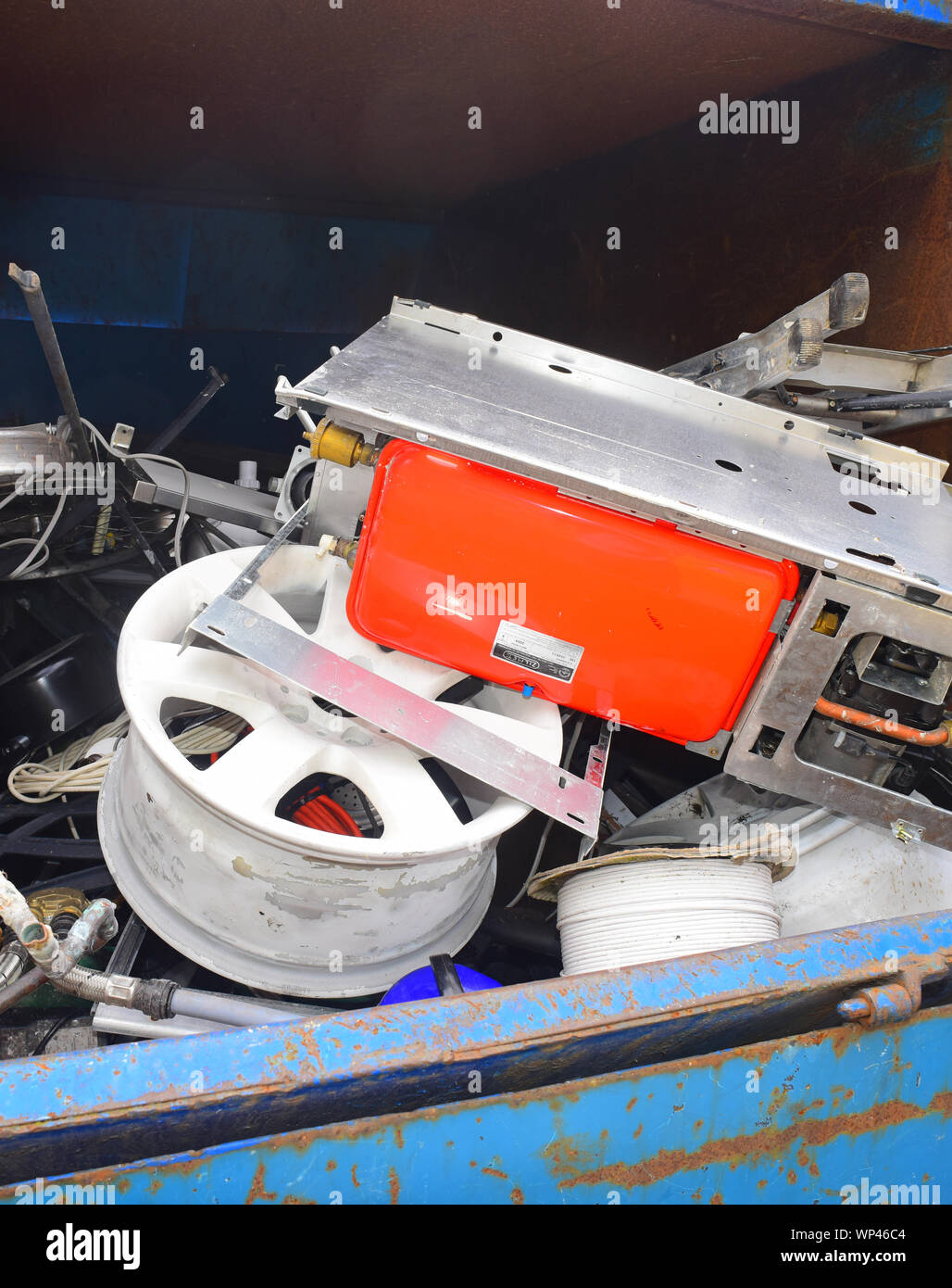 high value scrap metal items in skip ready for recycling at council household recycling centre united kingdom Stock Photo