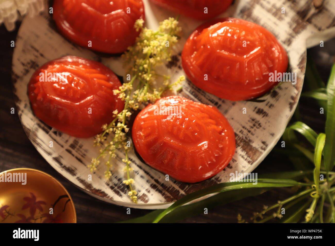 Ang Ku Kueh. Chinese red 'tortoise' cake of sticky rice shell with mung bean filling; popular in China and Southeast Asian countries. Stock Photo