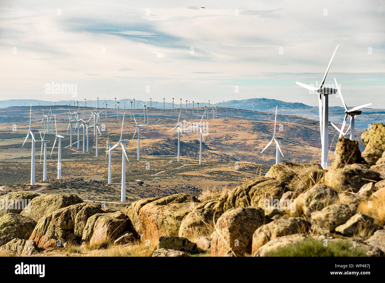Turbines of a large windfarm in the mountains of central Spain on a cold sunny day in November Stock Photo