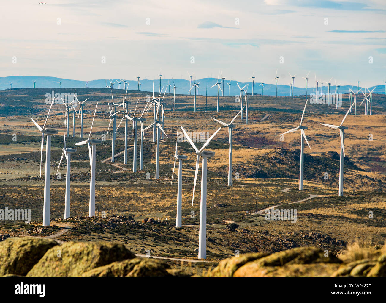 Turbines of a large windfarm in the mountains of central Spain on a cold sunny day in November Stock Photo