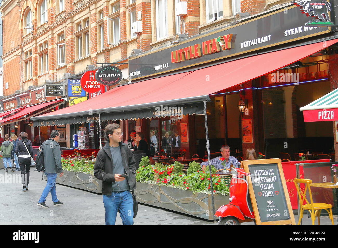 Diners sitting in the outside area of the Little Italy restaurant near Leicester Square, London, UK Stock Photo