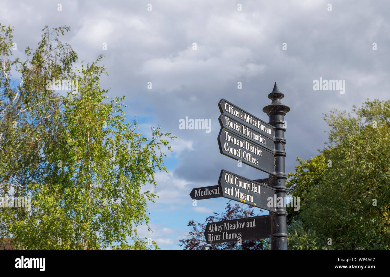 Traditional signpost giving directions to local amenities and places of interest in historic Abingdon-on-Thames, Oxfordshire, south-east England, UK Stock Photo