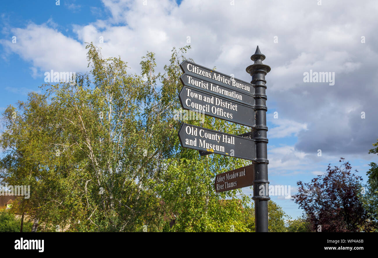 Traditional signpost giving directions to local amenities and places of interest in historic Abingdon-on-Thames, Oxfordshire, south-east England, UK Stock Photo