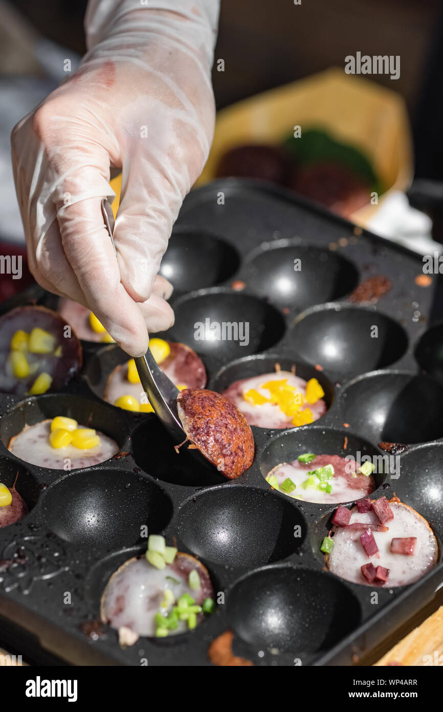 Cooking of the Kanom Krok or coconut rice pancakes. Stock Photo