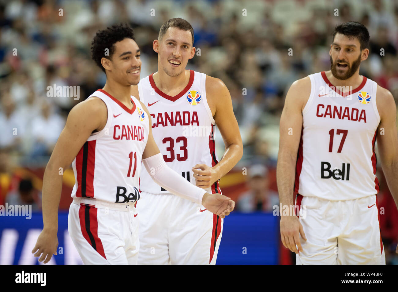 Shanghai, China. 07th Sep, 2019. Basketball: World Cup, Canada - Jordan,  placement round at Oriental Sports Center. Canada's Andrew Nembhard (l-r),  Kyle Wiltjer and Owen classes are pleased. Credit: Swen Pförtner/dpa/Alamy  Live