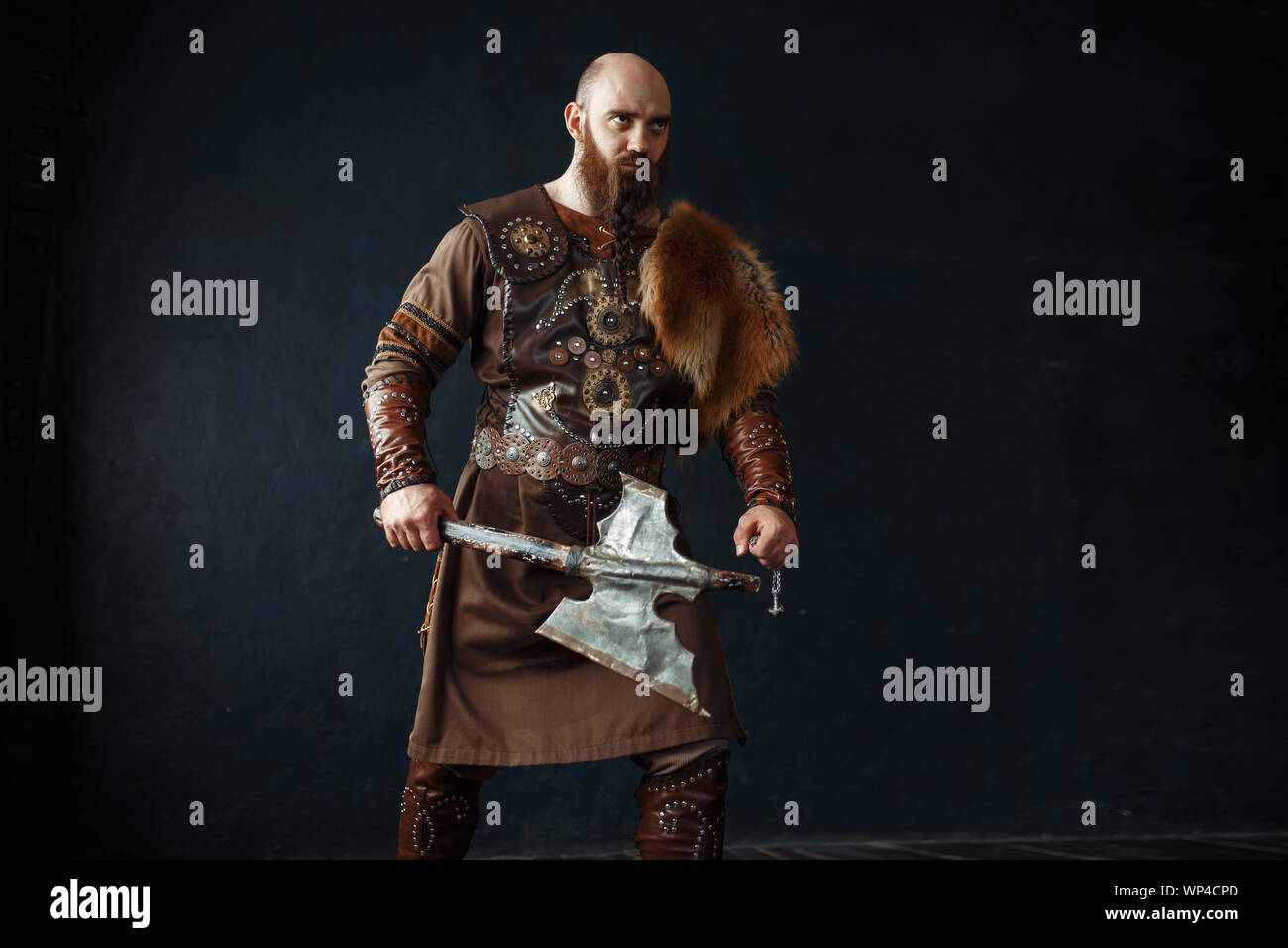 Viking with axe in traditional nordic clothes Stock Photo - Alamy