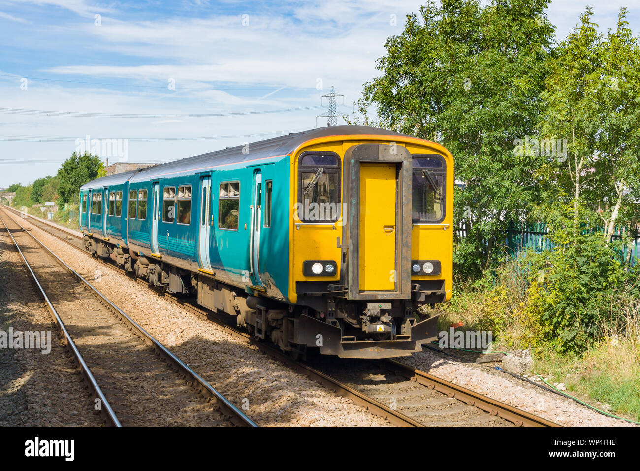 Generic diesel multiple unit or DMU train on a British railway commonly used on rural and main rail lines for commuter services in the UK Stock Photo