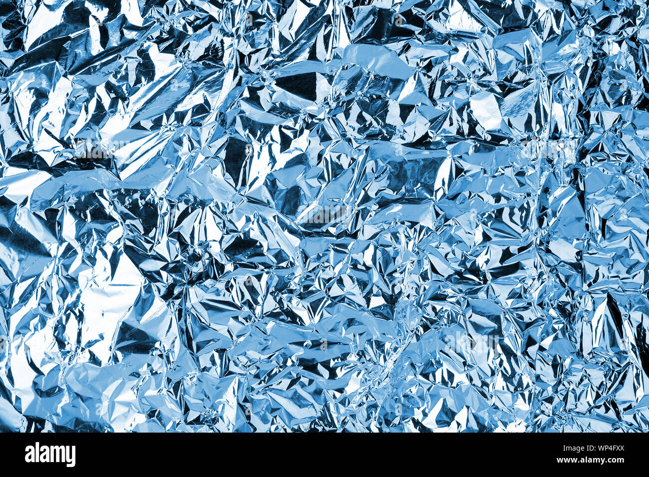 Abstract red and blue aluminum wrinkled foil background texture reflecting  red and blue light Stock Photo - Alamy