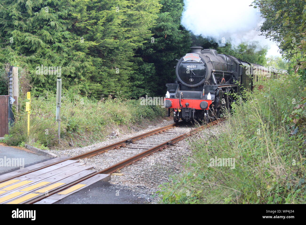 The 45231 Sherwood Forester steam train passes Howey level crossing on the Heart of Wales line on Sept 7th 2019 Stock Photo