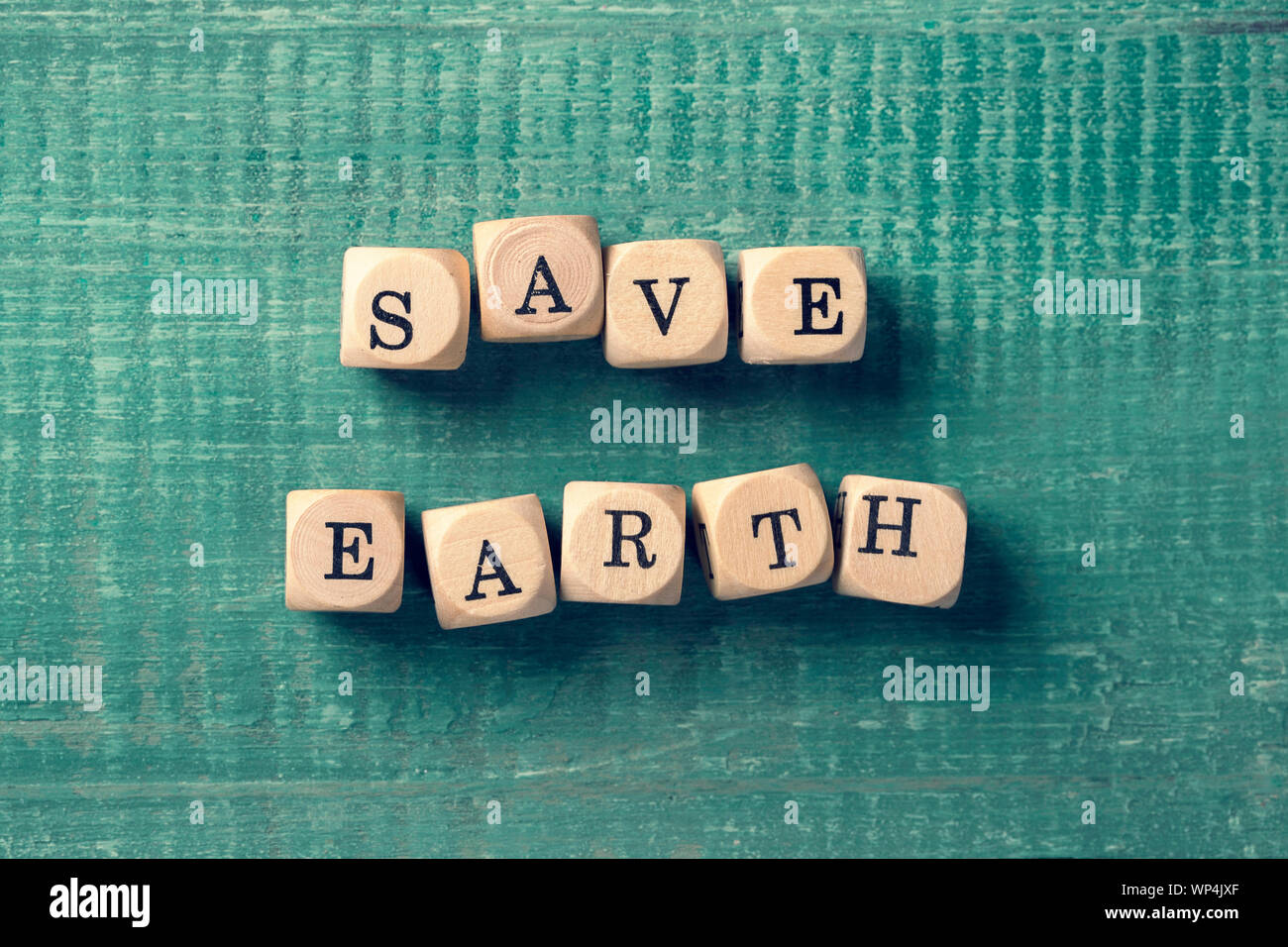 Letter cubes with word save earth. Environment concept. Stock Photo