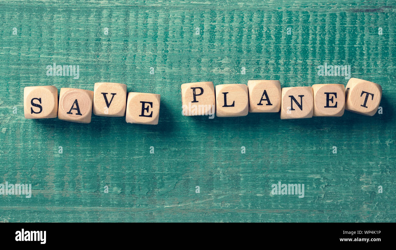 Letter cubes with word save planet. Environment concept Stock Photo - Alamy
