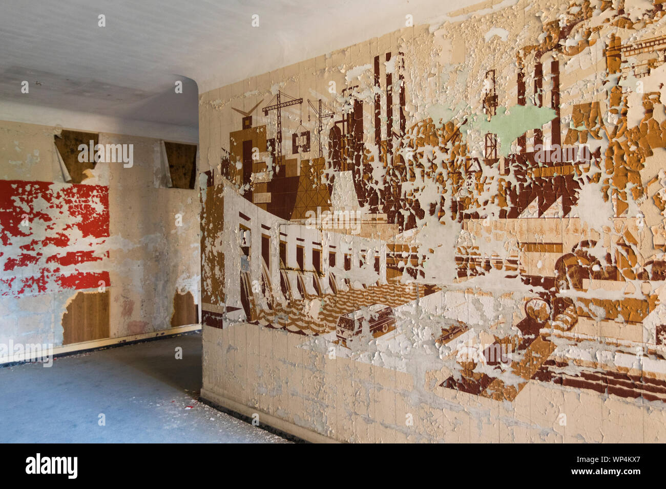 Communist wall art depicting weapon industry at former historical headquarters barracks in, Wünsdorf, Germany, abandoned by the Russian army in 1994 Stock Photo