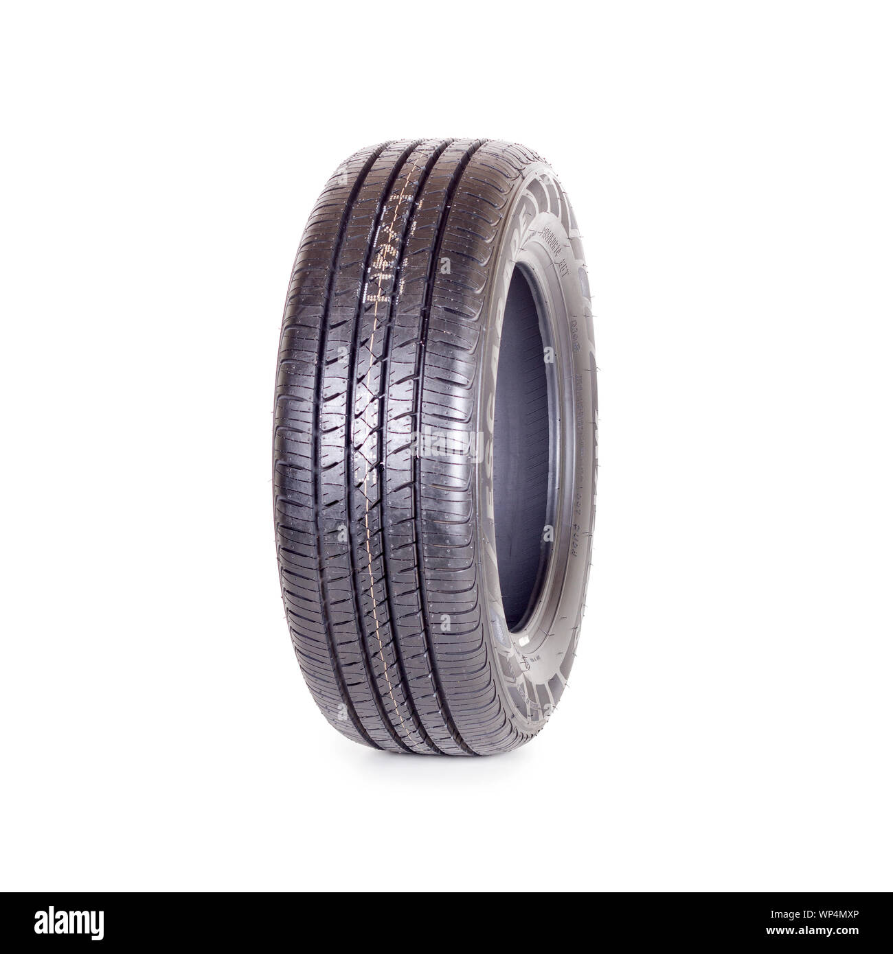 Car tire, new tyre Maxxis Escapade on white background isolated close up Stock Photo