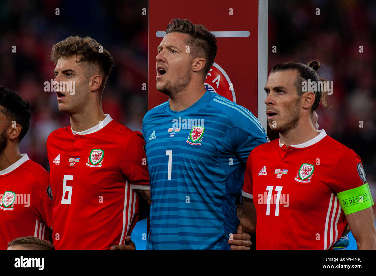joe-rodon-l-wayne-hennessey-gareth-bale-r-of-wales-perform-the-national-anthem-wales-v-azerbaijan-uefa-euro-2020-qualifier-at-the-cardiff-city-WP4NRJ.jpg