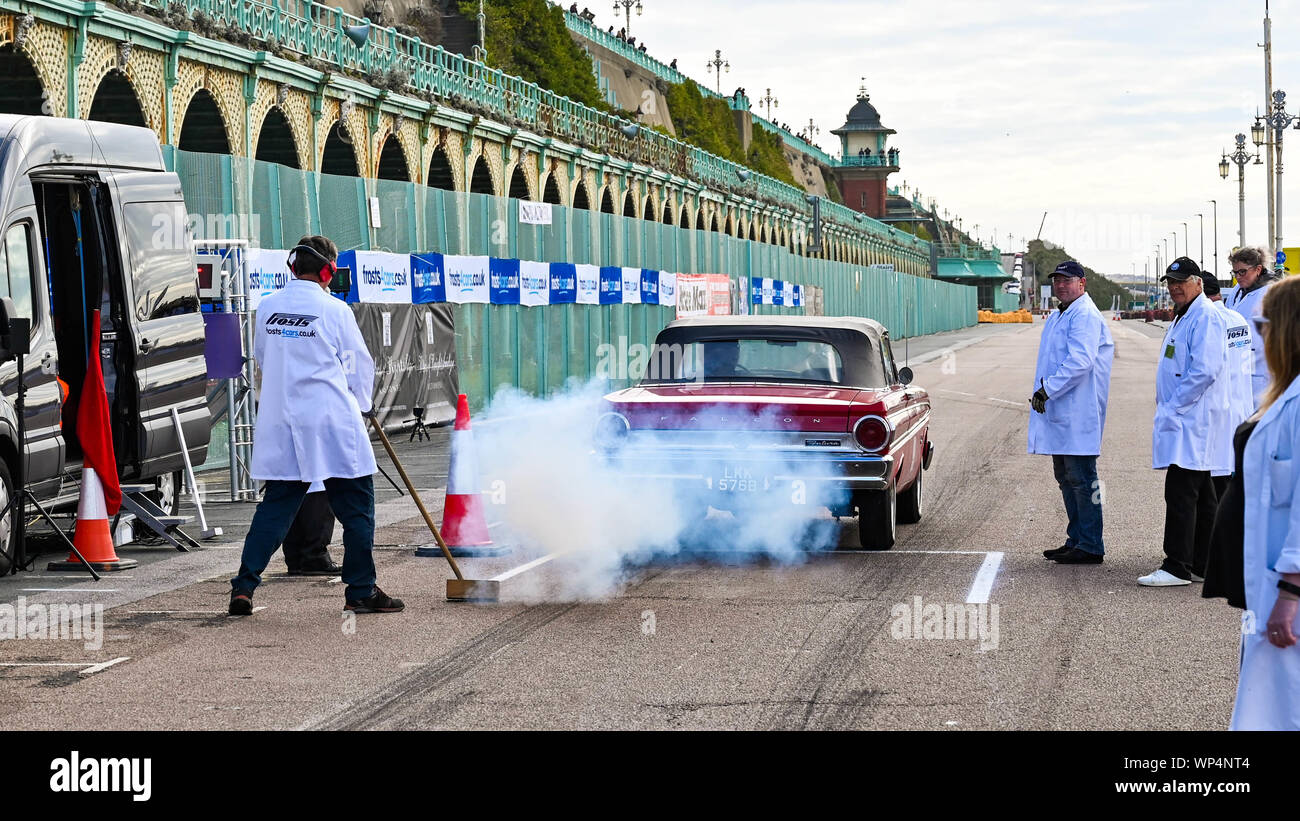 Brighton UK 7th September 2019 - Competitors head off in a cloud of smoke as they take part in the annual Brighton National Speed Trials along Madeira Drive on the seafront . The event is run by the Brighton and Hove Motor Club and is open to cars and motorcycles old and new with some of the drivers in their eighties as well . Credit : Simon Dack / Alamy Live News Stock Photo