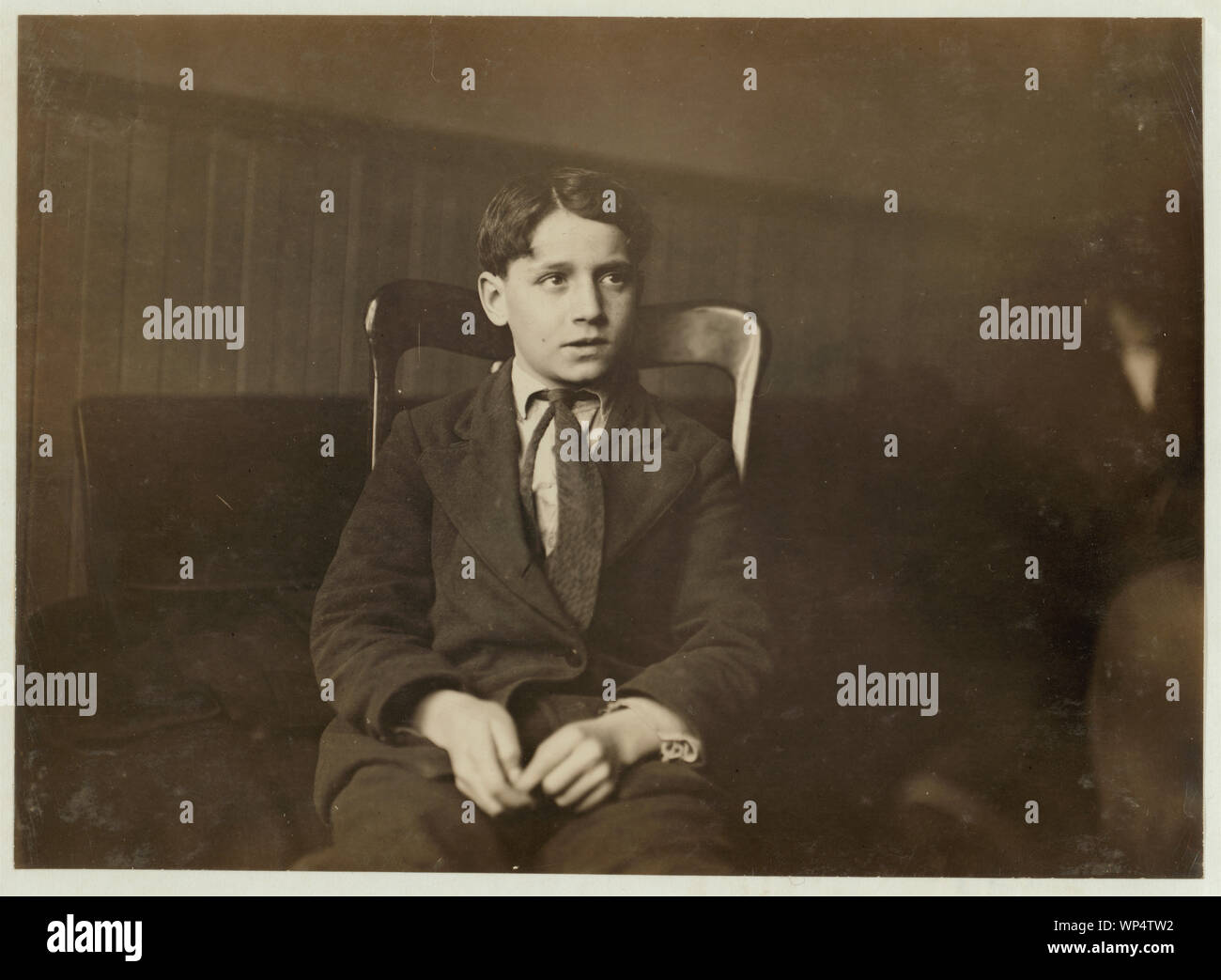 Joseph Buonasari, 207 7th Street, Buffalo, N.Y. Second Grade, School #1. 12 years old last summer. Worked on beans and apples and tomatoes in sheds and factory, getting 50 cents a day, sometimes until 8 P.M. Parents sometimes work all night until 5 A.M. Entered School #1, January 11th from School #2. Stock Photo