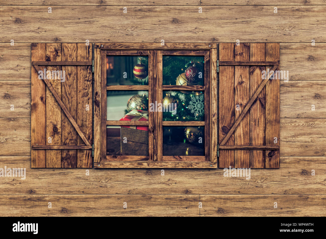 view of wooden facade with Window showing Christmas motifs Stock Photo