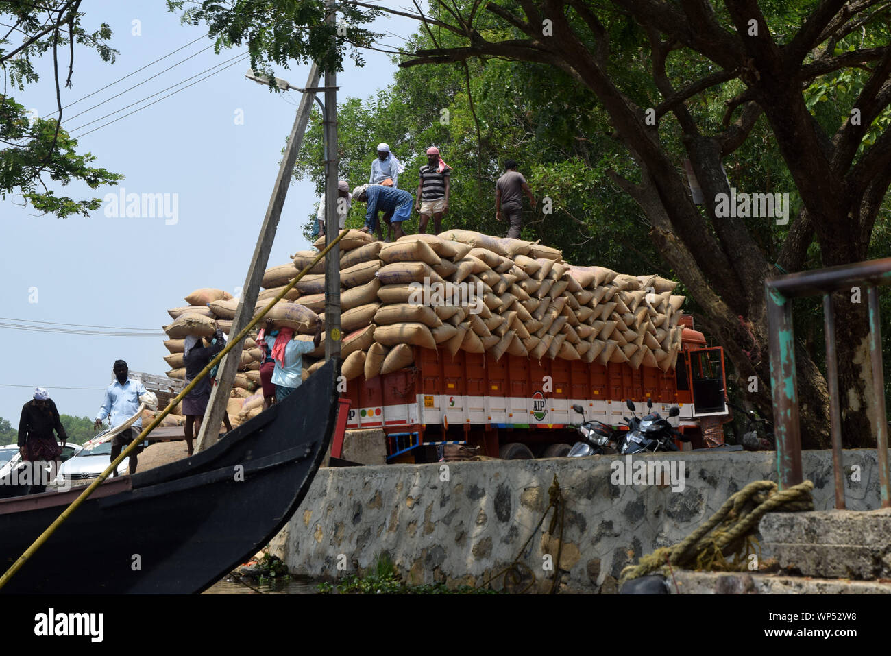 Lorry deliver sacks of rice, Alleppey, Kerala, India Stock Photo