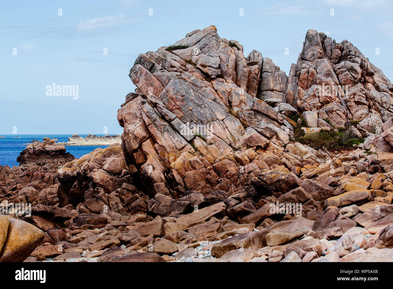 View of Bretonic Coast and Beach with Granite Rocks at the Cote de Granit Rose in Summer - Pink Granite Coast Stock Photo