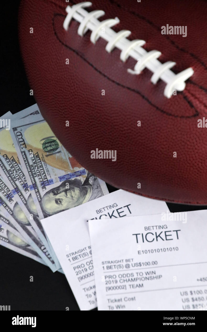 Legal sports betting in the USA witch cash or bitcoin on baseball and  football and other major sports Stock Photo - Alamy