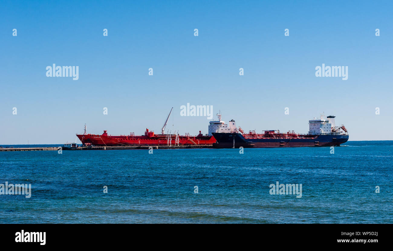 MISSISSAUGA, CANADA - OCTOBER 10, 2016: Two tanker ships are docked at the Suncor Energy lubricants plant on the northern shore of Lake Ontario. Stock Photo