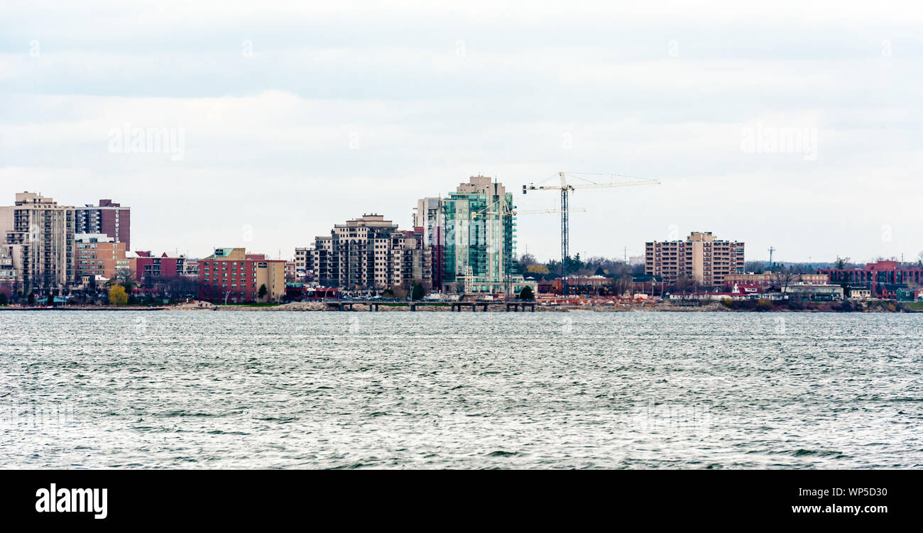 BURLINGTON, CANADA - APRIL 16, 2017: A mix of existing buildings, modern structures, and new construction fill the downtown waterfront area by Lake On Stock Photo