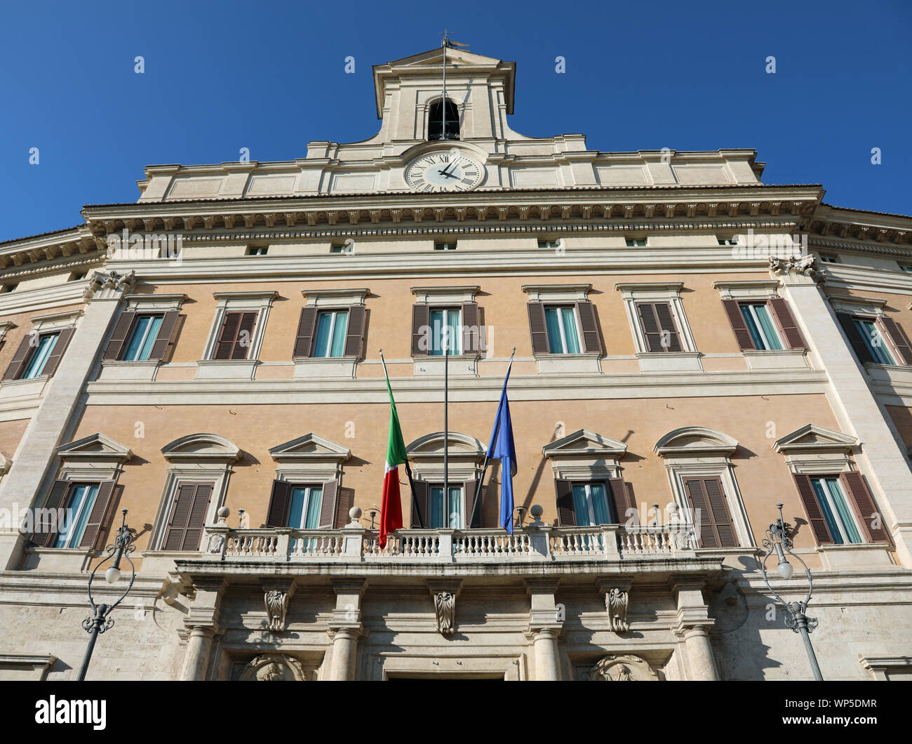 Italian parliament with flags and no people on a beautiful sunny day Stock Photo