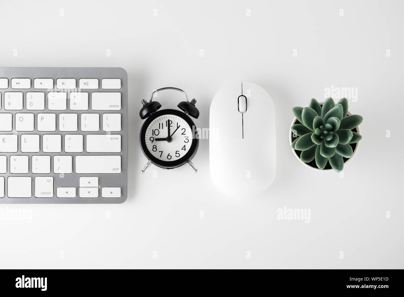 Computer Keyboard Mouse And Clock On White Desk Online Sale