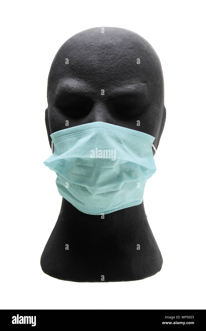 Dummy Head with Surgical Mask on White Background Stock Photo
