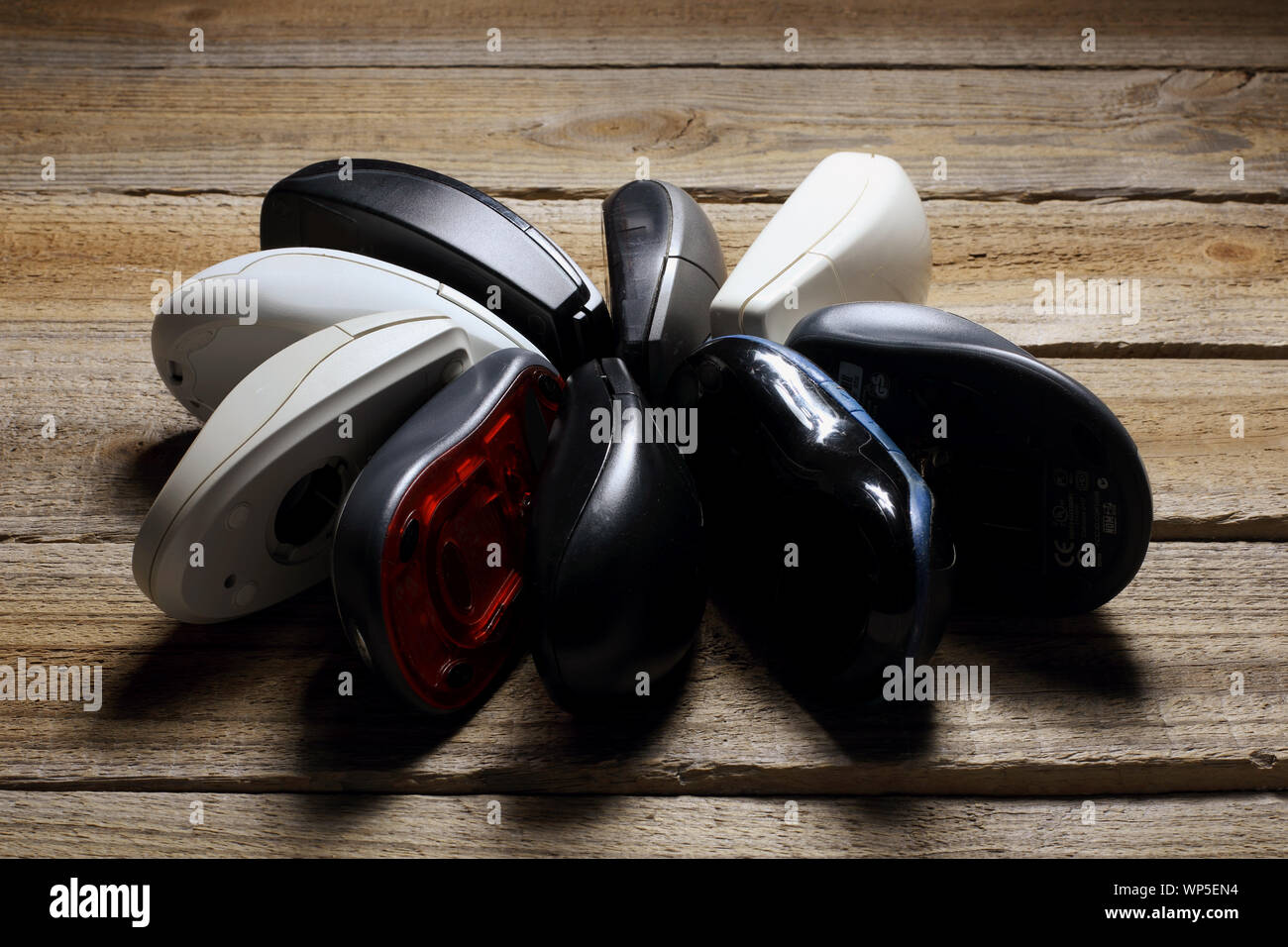 Computer Mouses on Wooden Background Stock Photo