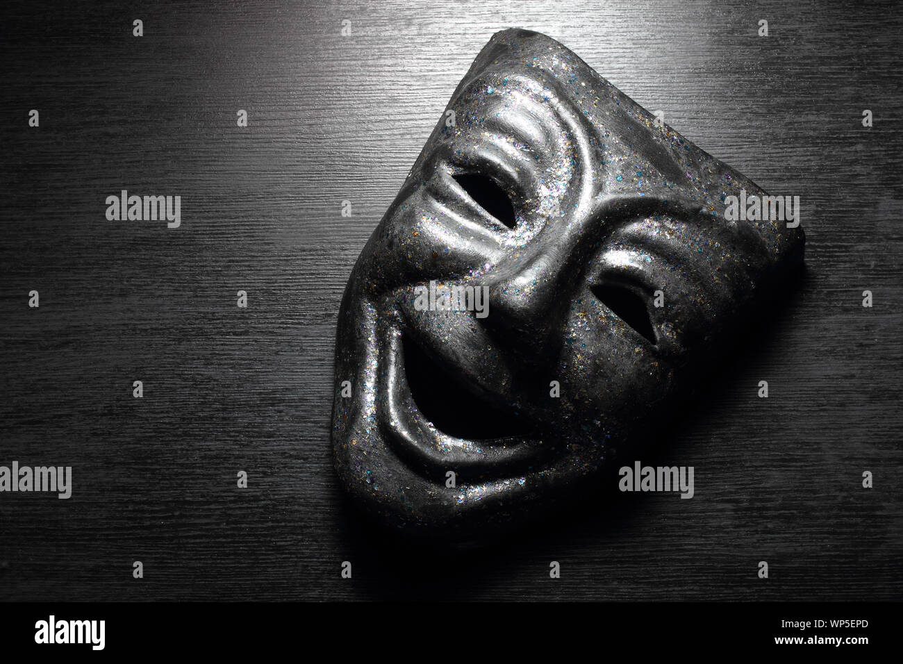Face Mask on Wooden Background Stock Photo