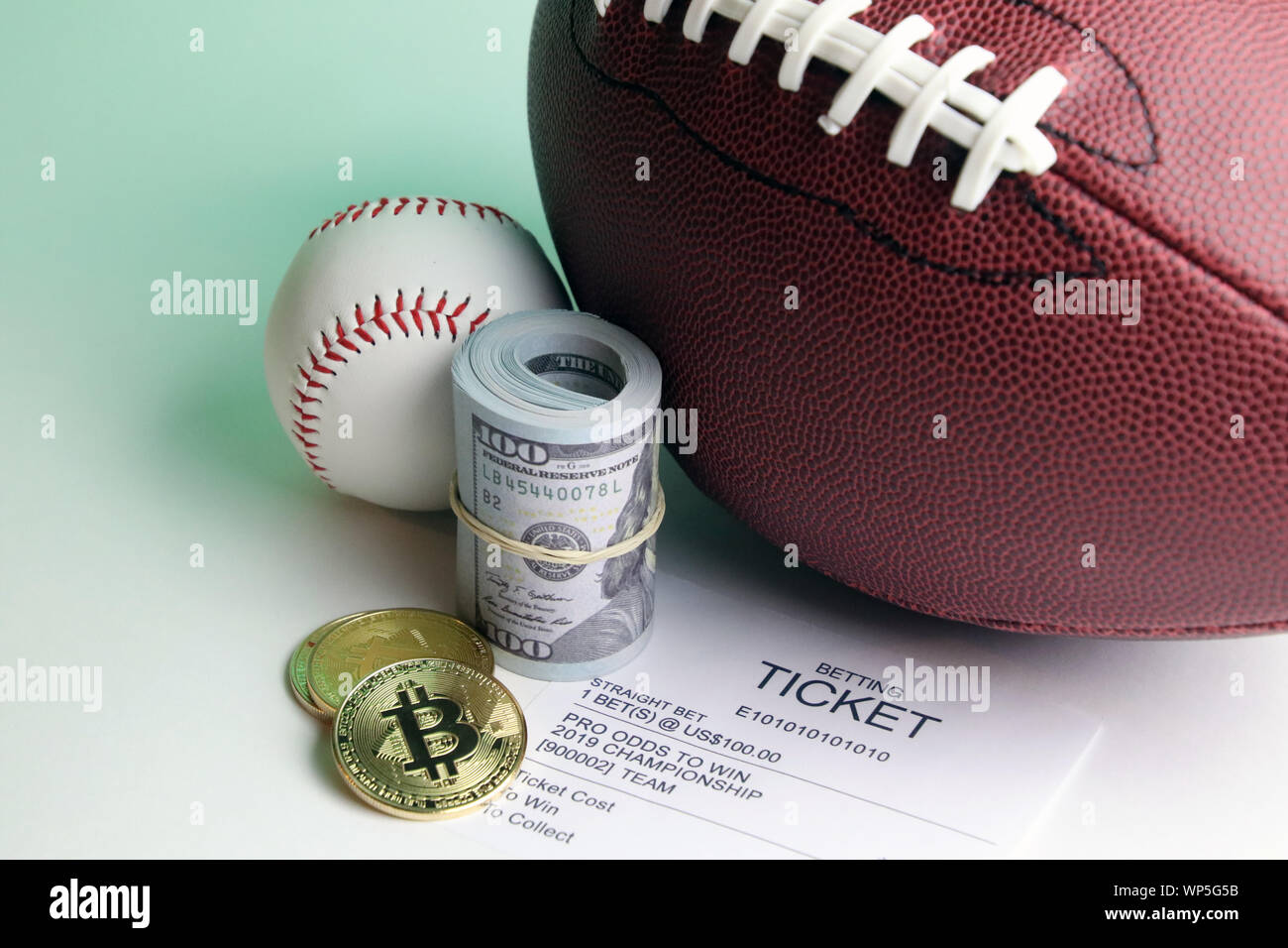 Legal sports betting in the USA witch cash or bitcoin on baseball and  football and other major sports Stock Photo - Alamy