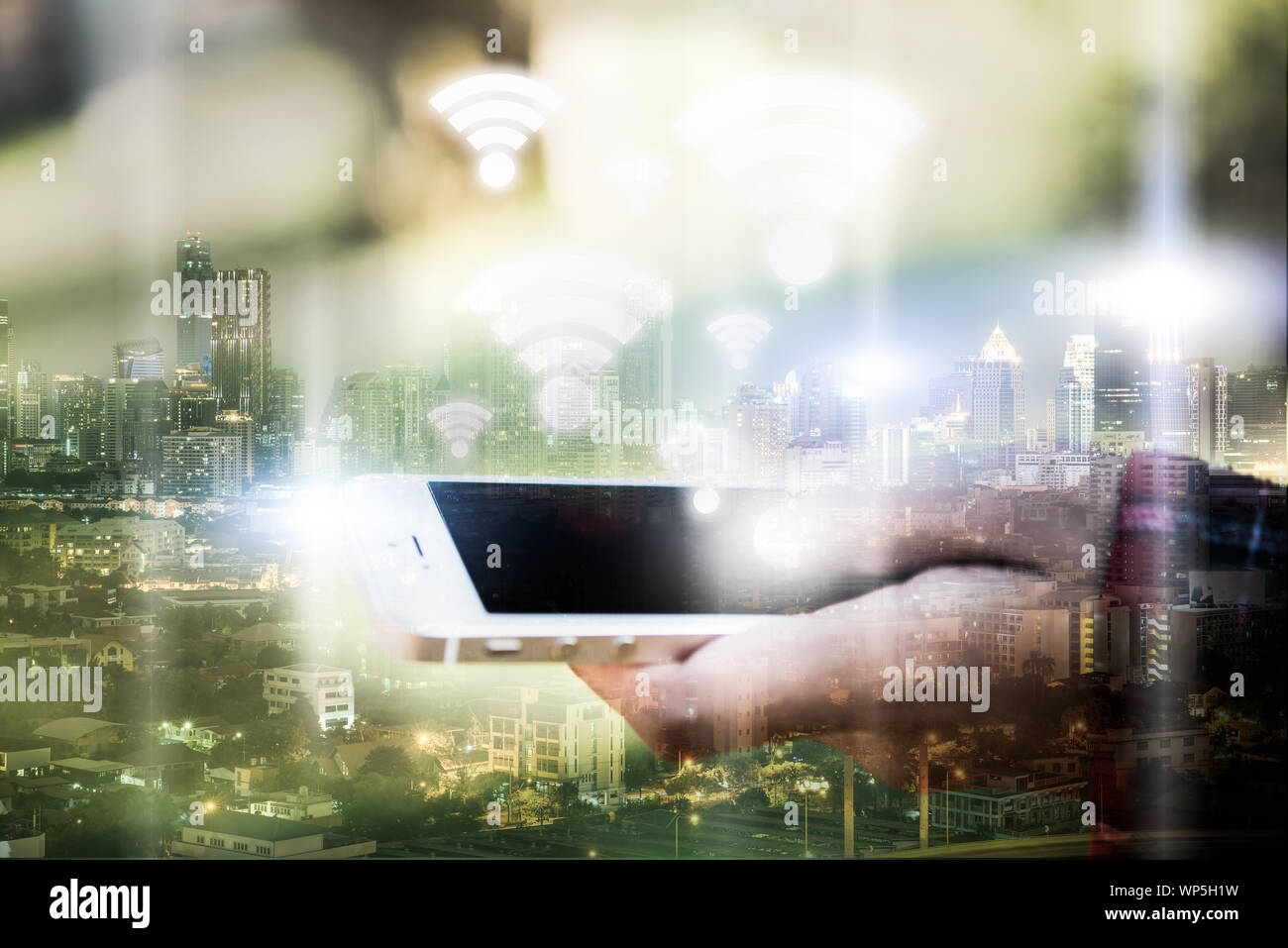 double exposure of woman hand hold and touch screen with wifi icon ...