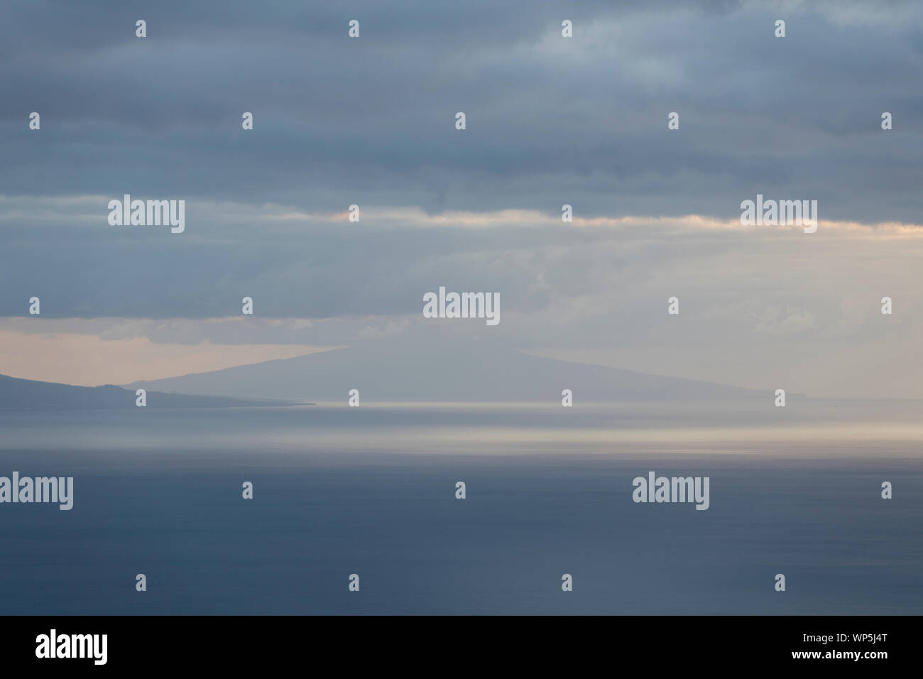 Landscape image showing cloud layers over Faial island as seen from Sao Jorge Island, Azores, Portugal Stock Photo