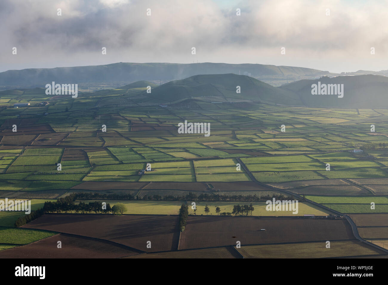 Aerial view on abstract pattern of fields at Serra do Cume and Serra da Ribeirinha before or after sunset or sunrise with low light shadows over the w Stock Photo