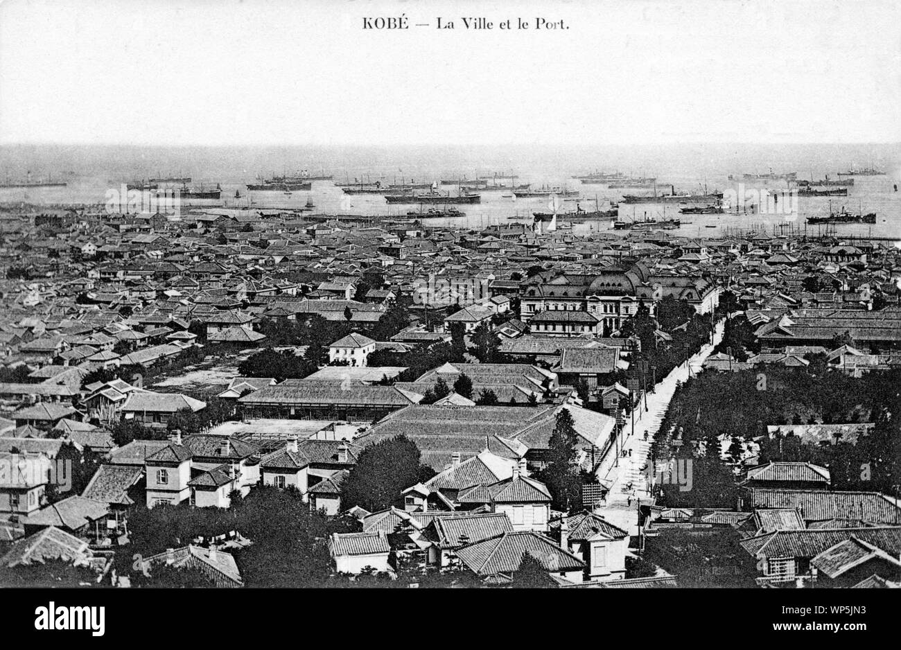 [ 1900s Japan - Panoramic View on Kobe ] —   Panoramic View on Kobe. The big square building right off the middle is Hyogo Prefectural Office, completed in 1902. The harbor is crowded with steamers.  This postcard is from a series of French cards shot sometime between 1902 and 1907.  20th century vintage postcard. Stock Photo