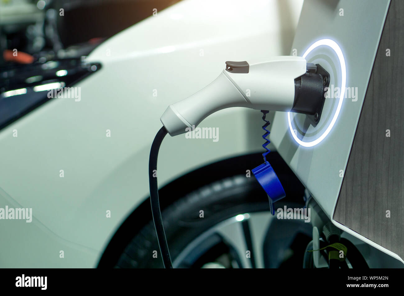 EV fuel Plug Charger technology for electric vehicle hybrid car. Stock Photo