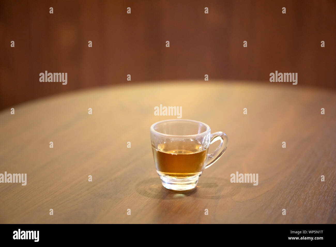 Cup of Lingzhi mushroom hot tea on wood table. Stock Photo