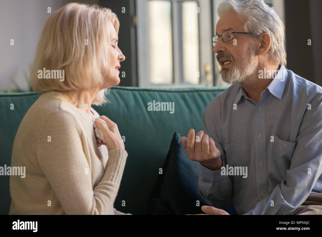 Mature couple talk discussing family problems at home Stock Photo