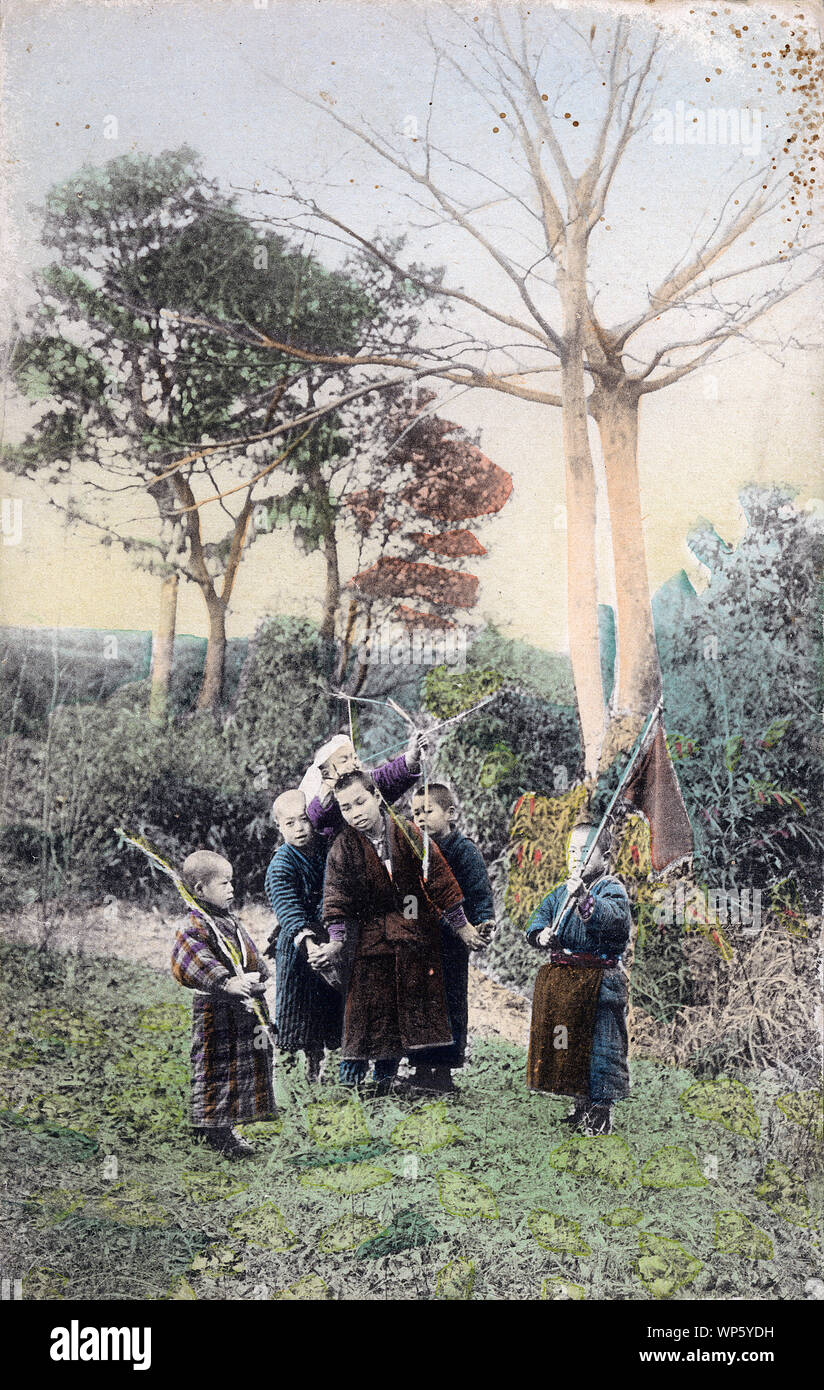 [ 1900s Japan - Japanese Country Boys Playing ] —   Six boys playing with bows and arrows.  20th century vintage postcard. Stock Photo