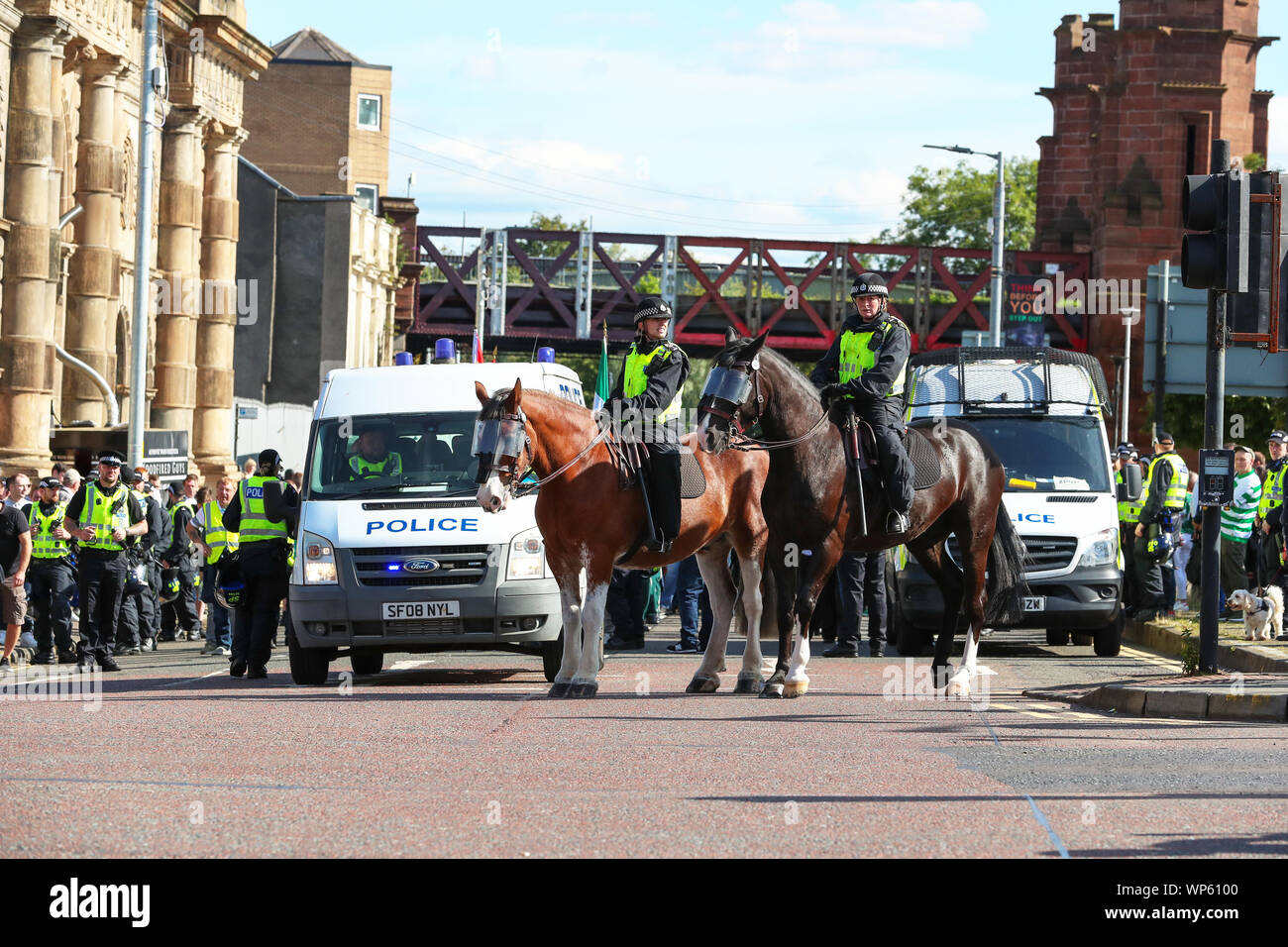 Glasgow, UK 07 September 2019. The Pro-Republican, Pro Irish group, the Calton Republicans marched through Glasgow's east end from Millroad Street to Clyde Street and stopped at the anti fascist statue celebrating the people of Glasgow who fought against Franco in the Spanish civil war. After the recent and significant street disturbances in Govan between sectarian groups there was a heavy police presence to prevent any disorder. Credit: Findlay/Alamy News Stock Photo