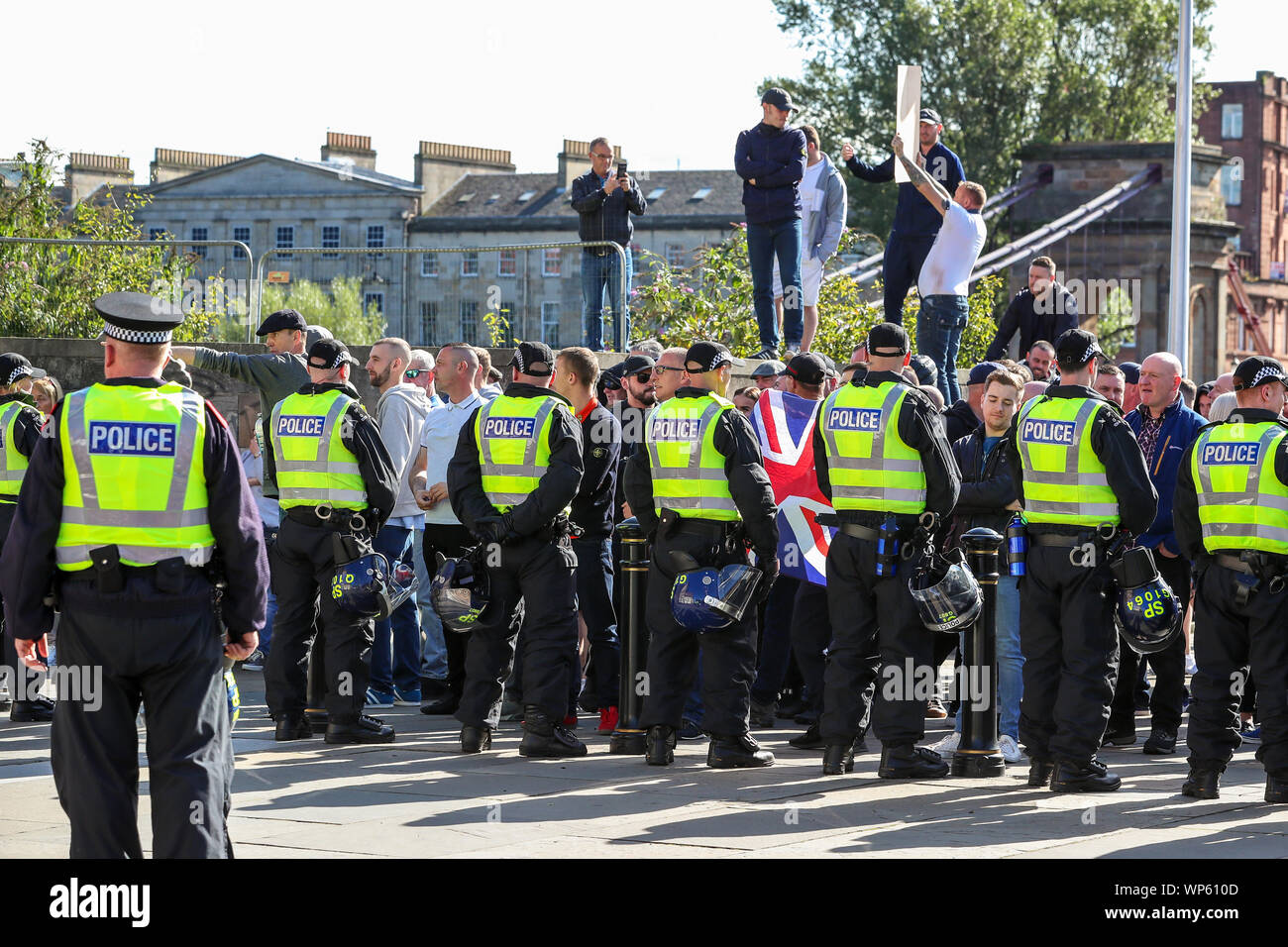 Glasgow, UK 07 September 2019. The Pro-Republican, Pro Irish group, the Calton Republicans marched through Glasgow's east end from Millroad Street to Clyde Street and stopped at the anti fascist statue celebrating the people of Glasgow who fought against Franco in the Spanish civil war. After the recent and significant street disturbances in Govan between sectarian groups there was a heavy police presence to prevent any disorder. Credit: Findlay/Alamy News Stock Photo