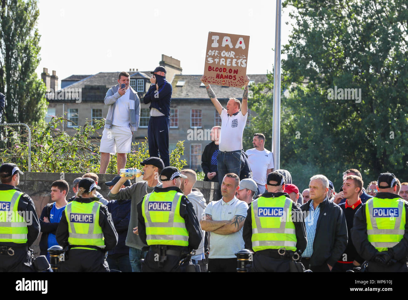 Glasgow, UK 07 September 2019. The Pro-Republican, Pro Irish group, the Calton Republicans marched through Glasgow's east end from Millroad Street to Clyde Street and stopped at the anti fascist statue celebrating the people of Glasgow who fought against Franco in the Spanish civil war. After the recent and significant street disturbances in Govan between sectarian groups there was a heavy police presence to prevent any disorder. Credit: Findlay/Alamy News Stock Photo