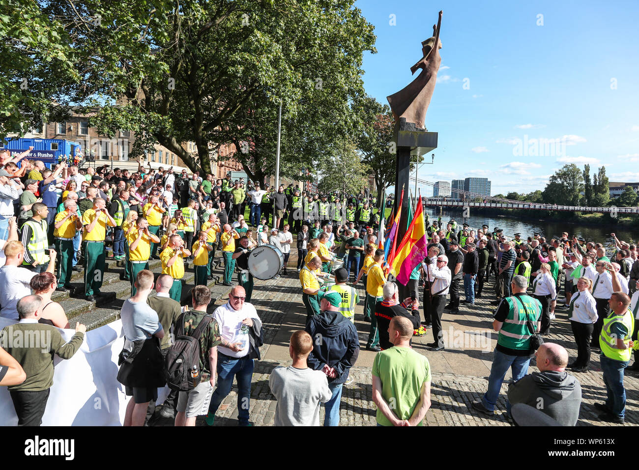 Glasgow, UK 07 September 2019. The Pro-Republican, Pro Irish group, the Calton Republicans marched through Glasgow's east end from Millroad Street to Clyde Street and stopped at the anti fascist statue celebrating the people of Glasgow who fought against Franco in the Spanish civil war. After the recent and significant street disturbances in Govan between sectarian groups there was a heavy police presence to prevent any disorder. Credit: Findlay/Alamy News Stock Photo